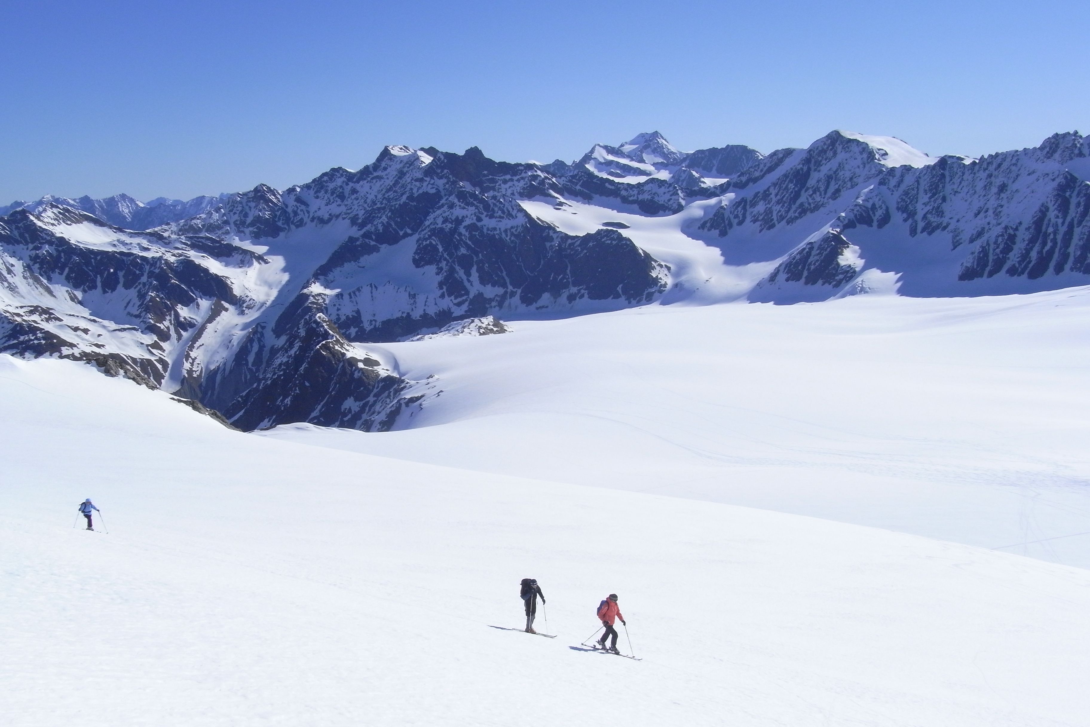Picture of mountain top with people skiing